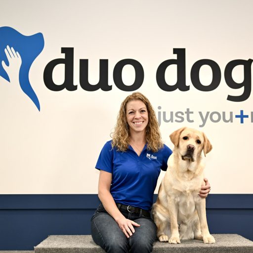 Beth sitting next to Duo Dog Woody